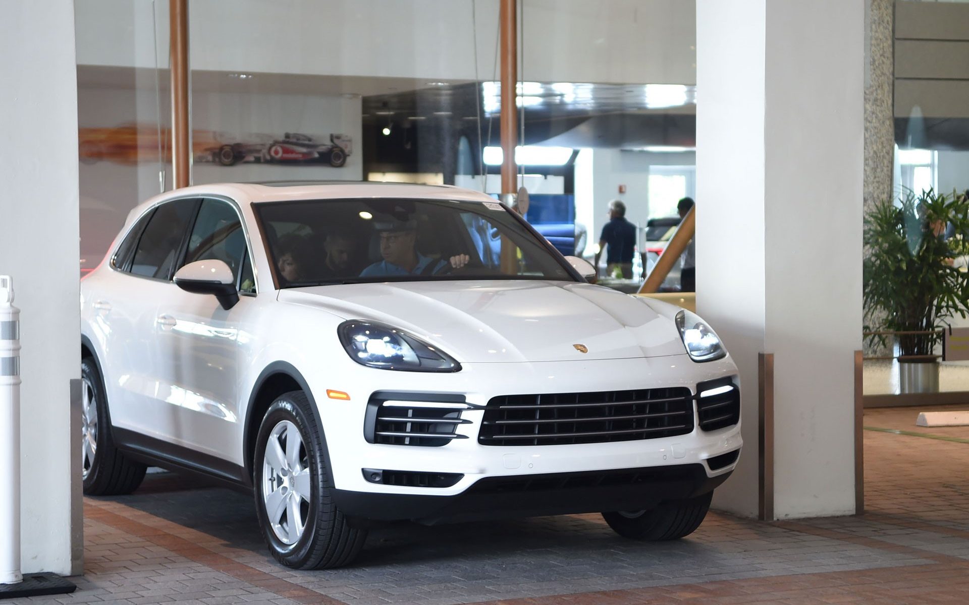 white porsche cayenne at THE COLLECTION showroom